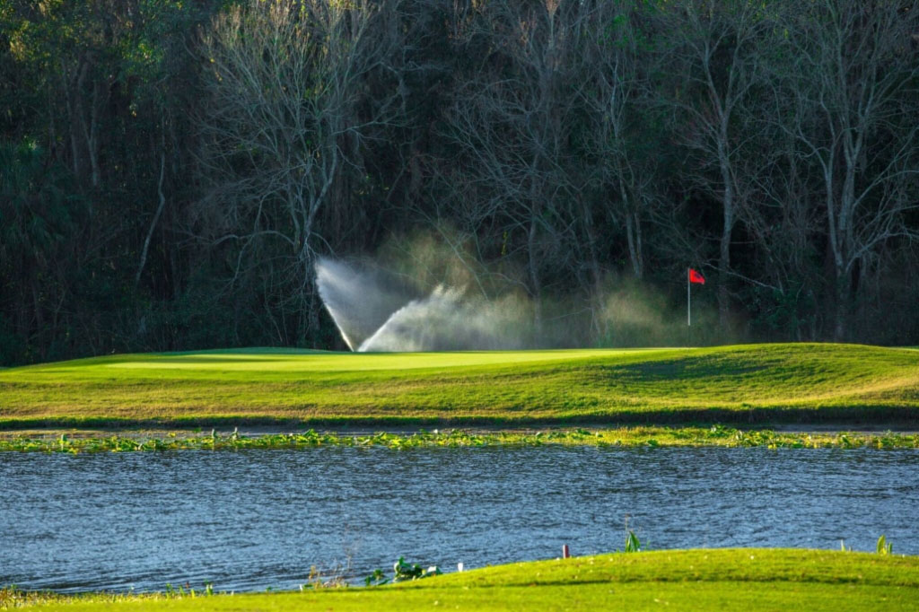 Course greens with sprinklers on 