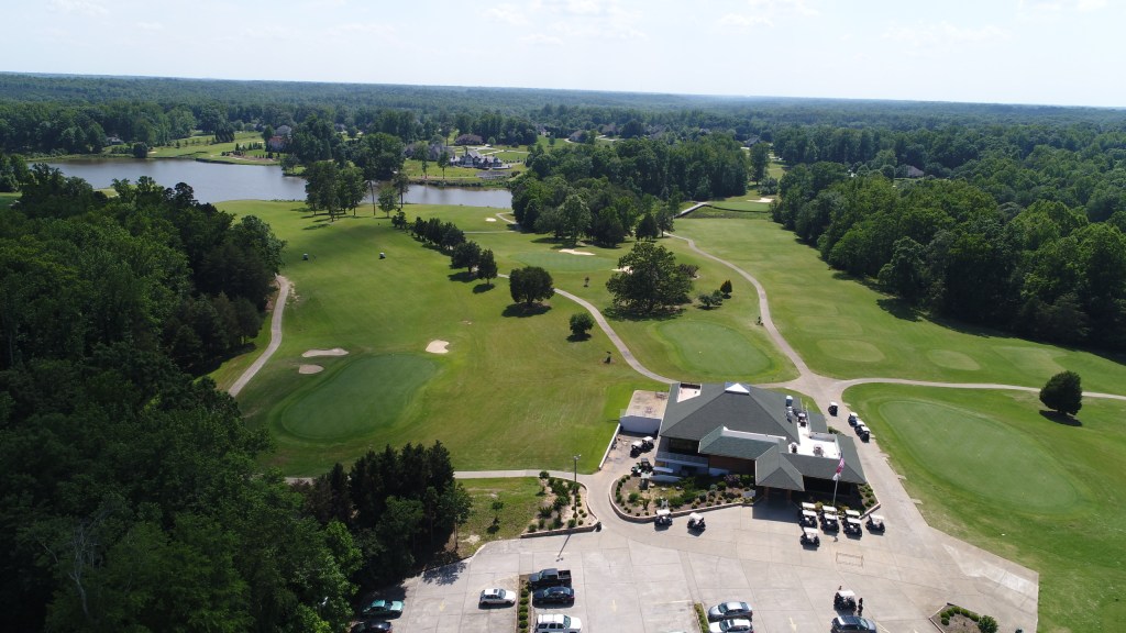 overhead view of clubhouse looking out into the course