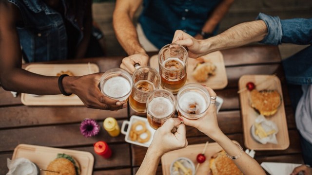 Friends toasting at dining room