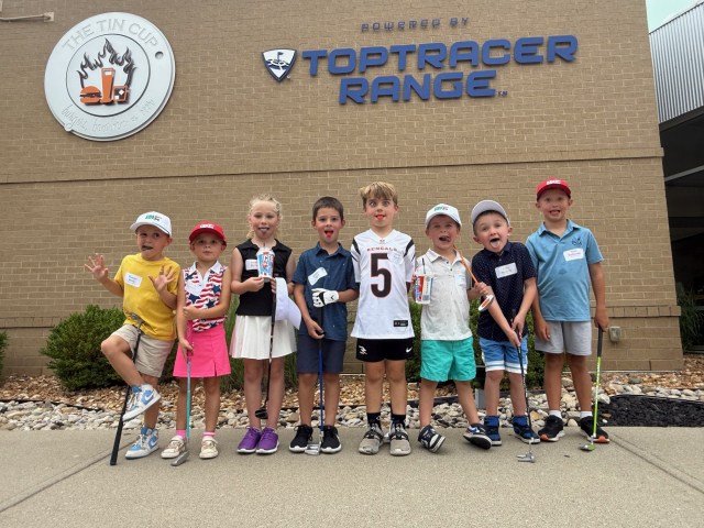 Youth golfers in front of Toptracer Range